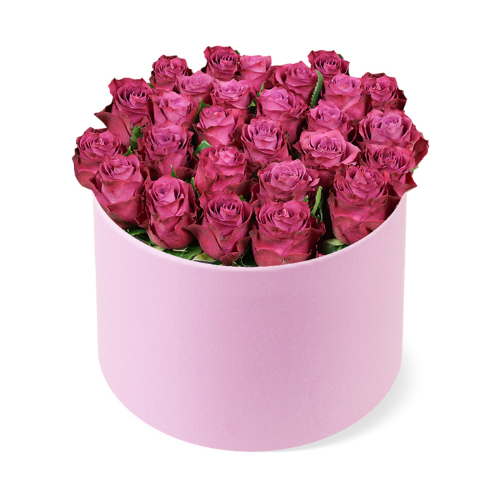 With deliberate balance, this luxurious arrangement showcases a field of roses in deep magenta, their petals curling into a dense, domed crown that fills the round, light-pink hat box. The blooms sit like jewels against the soft, matte-textured container, a pairing that feels both modern and classical. Only minimal green foliage threads between the heads, ensuring the blossom's colour and form remain the focal point. The petals' gradient-lighter pink centres fading to richer purples at the edges-gives the bouquet depth and a subtle shimmer under studio light. The image is captured from a slightly elevated angle on a pristine white background, which isolates the bouquet and heightens its sculptural elegance.

This design is a versatile messenger of romance and celebration-an anniversary, a birthday, or a gift that marks a significant moment. In NW London and Stanmore, it complements a refined dining space or a boutique wedding table near Canons Park, while also serving as a premium gift for delivery to a friend or relative in the area. The lily-like silence of the greens makes it feel timeless, and the pastel pink box adds a soft, romantic frame to the intense colour of the roses. It is a craft piece built by a seasoned florist who knows how to balance luxury with approachable charm, ready for same-day delivery to Stanmore households that appreciate elegant, high-end florals.

Delivered with care, it travels gracefully to light-filled living rooms or quiet corners in Canons Park, offering a lasting impression of refinement and warmth.