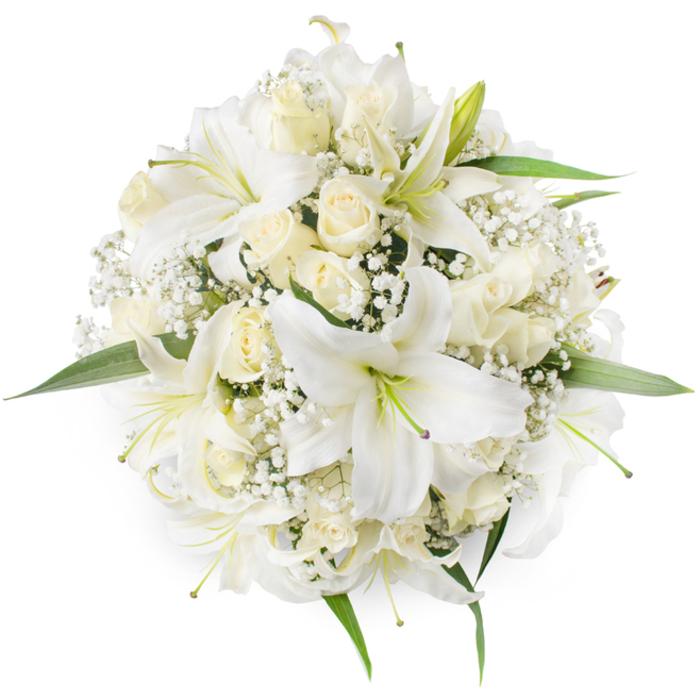 Captured in a clean overhead composition, this symmetrical, round bouquet presents an elegant study in white and cream: expansive white oriental lilies open wide to reveal pale green filaments and subtle yellow anthers, while clusters of creamy ivory roses - many showing their petals in tight spirals and some just beginning to unfurl - create a soft, layered heart to the design. Sprigs of tiny white Baby's Breath thread through the spaces, their cloud-like presence softening the visual mass and adding intricate, lace-like detail that invites close inspection. Around the edges, a smattering of bright green leaves provides fresh contrast and frames the arrangement so it sits crisply against the white backdrop. The style is classical and balanced, evoking the quiet dignity of a bridal bouquet, a poised centerpiece for a formal celebration, or a respectful arrangement suitable for memorial moments. Light in the image is diffuse and even, chosen to accentuate the flowers' textures: the satiny sheen of lilies, the velvet depth of rose petals, and the delicate, almost frosted fragility of gypsophila. A seasoned florist would note the bouquet's scent profile - the lilies' pronounced floral sweetness softened by the roses' comfortable warmth - and its readiness for occasions in Stanmore and the surrounding Harrow neighbourhoods, from ceremonies at local chapels to receptions near Stanmore Station and Canons Park. The composition communicates both skillful technique and a quiet emotional clarity, a floral piece that feels composed, trustworthy, and timeless.