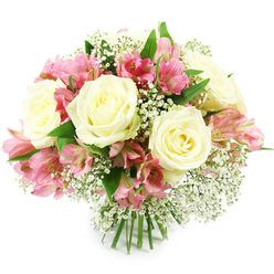 Against a spotless white backdrop, a domed bouquet of white roses, pink alstroemeria, and delicate baby's breath is captured in sharp detail, reflecting the calm elegance often associated with homes around Stanmore and along The Broadway. At the heart of the design sit several creamy white roses, fully open yet still structured, their petals layered like satin ribbons curling outward from centres that glow faintly with a hint of pale yellow. Between them, stems of pink alstroemeria create rhythm and movement, each bearing several trumpet-shaped blooms that shift from soft pastel edges to richer magenta tones inside. Fine speckles and stripes trace the inner petals, adding subtle drama reminiscent of sunset skies over the nearby green spaces of Stanmore Country Park. Threaded gently throughout are airy sprays of gypsophila, or baby's breath, their tiny white florets forming a soft veil that lightens the arrangement and bridges the contrast between rose and lily. Surrounding the flowers, glossy green leaves peek out in carefully balanced intervals, offering a fresh, garden-like frame that feels right at home in Stanmore's leafy streets. The straight green stems are visible at the bottom, tightly bound to form a classic, hand-tied bouquet ready to be placed in a clear glass vase on a kitchen table or living-room sideboard. Bright, even lighting illuminates every petal and leaf, making the colours appear clean and true while soft shadows add depth. The bouquet conveys a mood of gentle celebration and thoughtful kindness, perfectly suited for same-day flower delivery across Stanmore for birthdays, anniversaries, welcoming a new baby, or simply reminding someone that they are loved and appreciated.