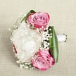 Infused with the gentle spirit of Stanmore, this romantic bouquet weaves together three bold pink roses, each bloom painted with ombre tones of magenta and soft blush, nestled among volume-rich, creamy white peonies. Threads of delicate baby's breath drift throughout the flowers like soft spring clouds over Stanmore Park, introducing a playful, fairy-tale grace. Encircling the bouquet, glossy green leaves fold smoothly to create a crisp, structured collar, making the colours even more luminous. The flowers are elegantly hand-tied with a satin white ribbon, its smoothness a subtle reflection of painstaking care. Set against a woven, neutral background, the arrangement exudes a peaceful, almost dreamlike elegance-an ideal accent for celebrations of love, weddings, or special moments in Stanmore. The bouquet's composure and freshness capture the hope and gentle scent of new beginnings, while its beauty lingers warmly in memory.