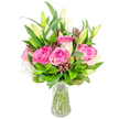 A lush, joy-filled bouquet of deep pink roses and pristine white lilies sits in a clear glass vase, its simple silhouette set against a bright white backdrop so each petal and leaf reads clearly. Several large roses take centre stage, their velvety petals unfurling from blush blush-pink to richer fuchsia at the heart, a tactile softness you can almost feel; the roses' rounded forms create a warm, romantic core. Around them, tall white lily buds-some tightly closed, others peeking open-offer elegant, trumpet-like lines and a cool, powdery scent that contrasts with the roses' sweet perfume. The arrangement is ringed and cupped by varied greenery: broad, glossy leaves catch the light with satin reflections while finer, feathery sprigs weave between blooms to add air and movement. Subtle darker burgundy or reddish-brown accent buds and foliage are threaded through the composition, giving shadowed depth and a sophisticated, autumnal undertone. The clear water in the vase reveals neat, freshly trimmed green stems and the slightly tapered base of the glass, highlighting the bouquet's freshness and clean presentation. Soft studio lighting creates gentle highlights and soft shadows on each petal and leaf, suggesting a calm, bright interior-perfect for a birthday table, an anniversary surprise, or a thoughtful 'thinking of you' gift. As a florist describing this arrangement to someone who cannot see it, I would emphasise how the colours, textures, and layered forms work together to create a balanced, celebratory mood: lively yet composed, fragrant yet refined, a bouquet meant to lift a room and the spirit.